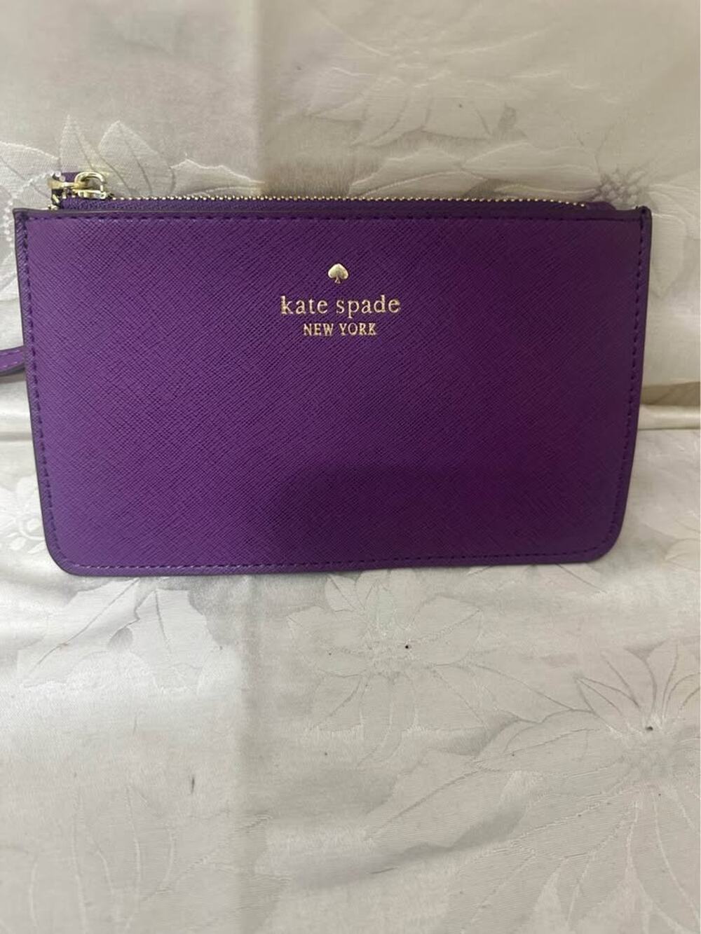 New Kate Spade New York purple pouch wristlet. B-300